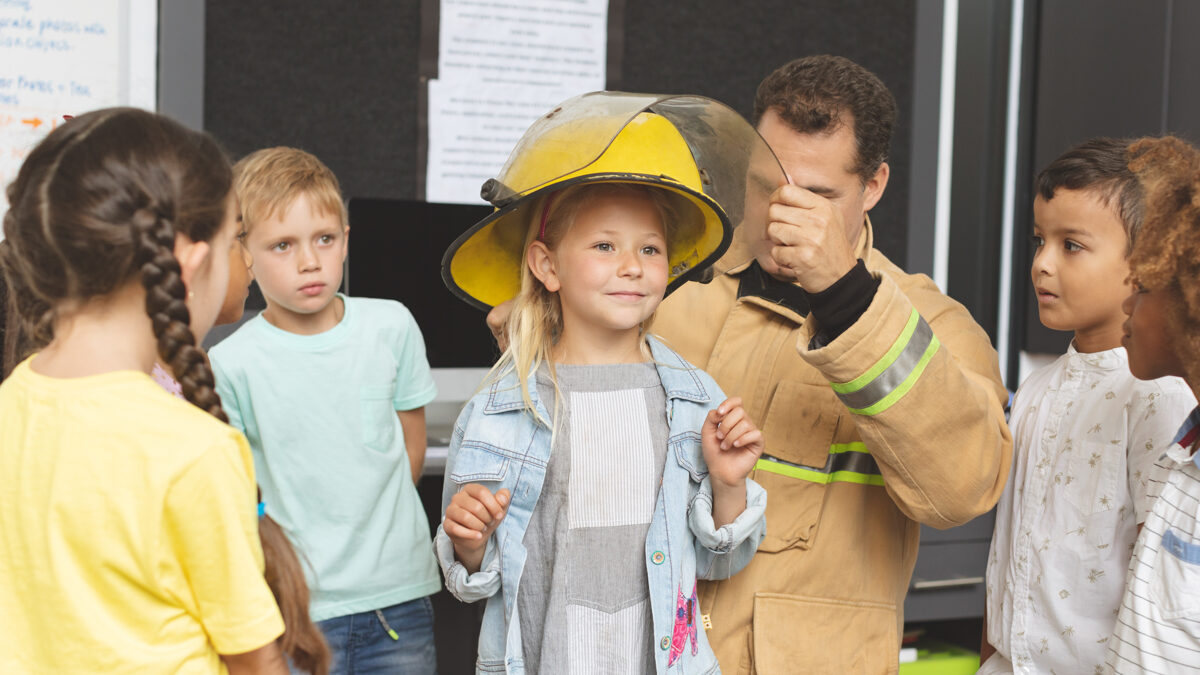 caucasian-firefighter-teaching-to-schoolkids-about-2025-04-03-13-00-30-utcneu.jpg
